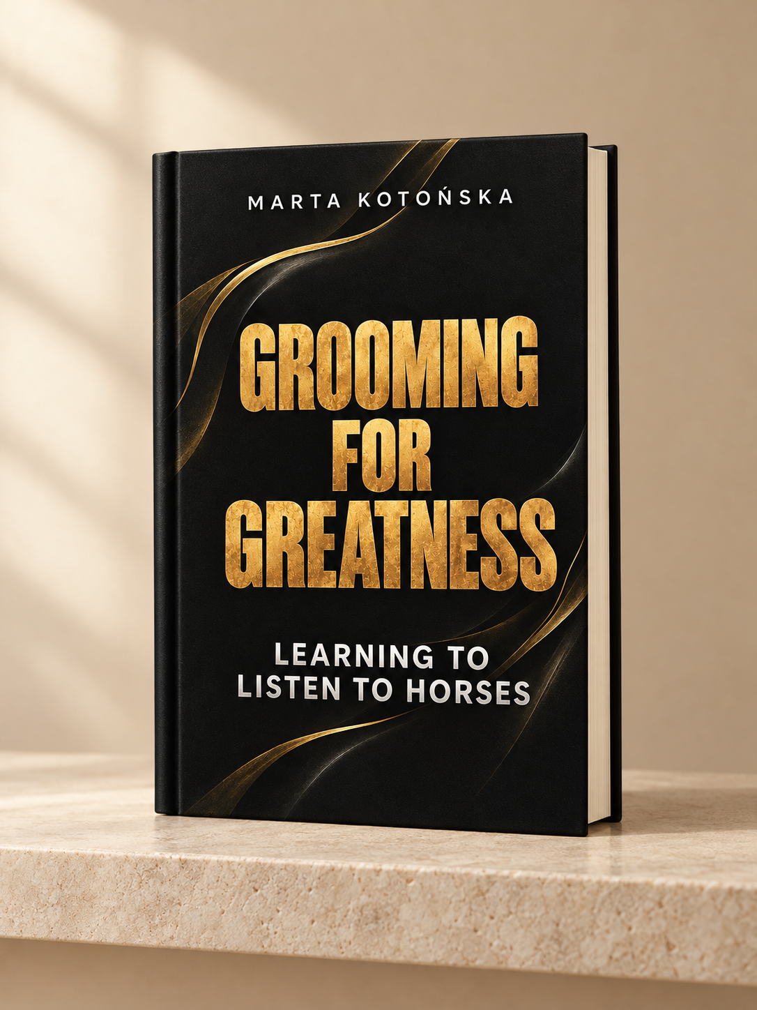 A hardcover book titled 'Grooming for Greatness: Learning to Listen to Horses' by Marta Kotonska, standing upright on a light stone surface against a warm beige background with soft window-shadow lighting.